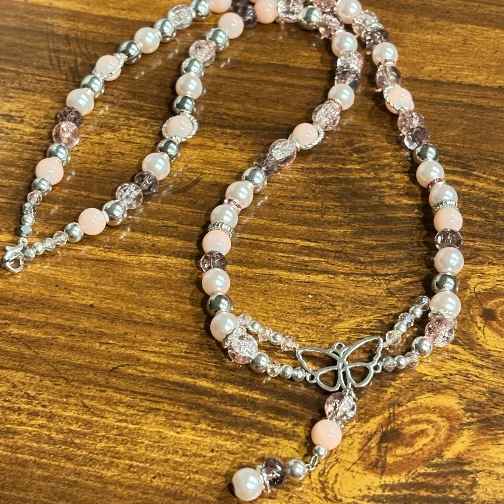Handmade by me 
Pink beaded necklace with butterfly charm
